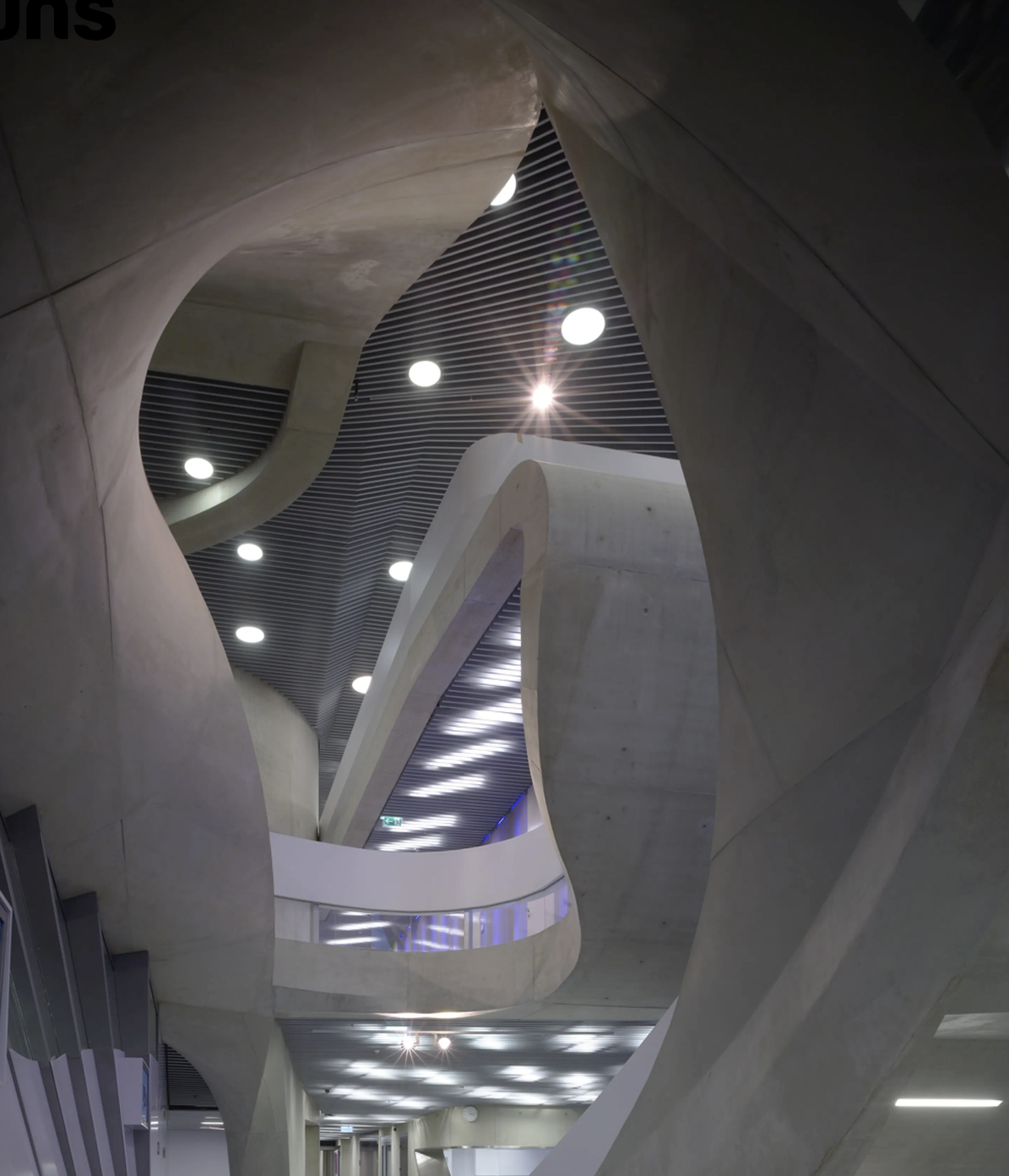 Interior of the MUMUTH with its curved concrete structure.