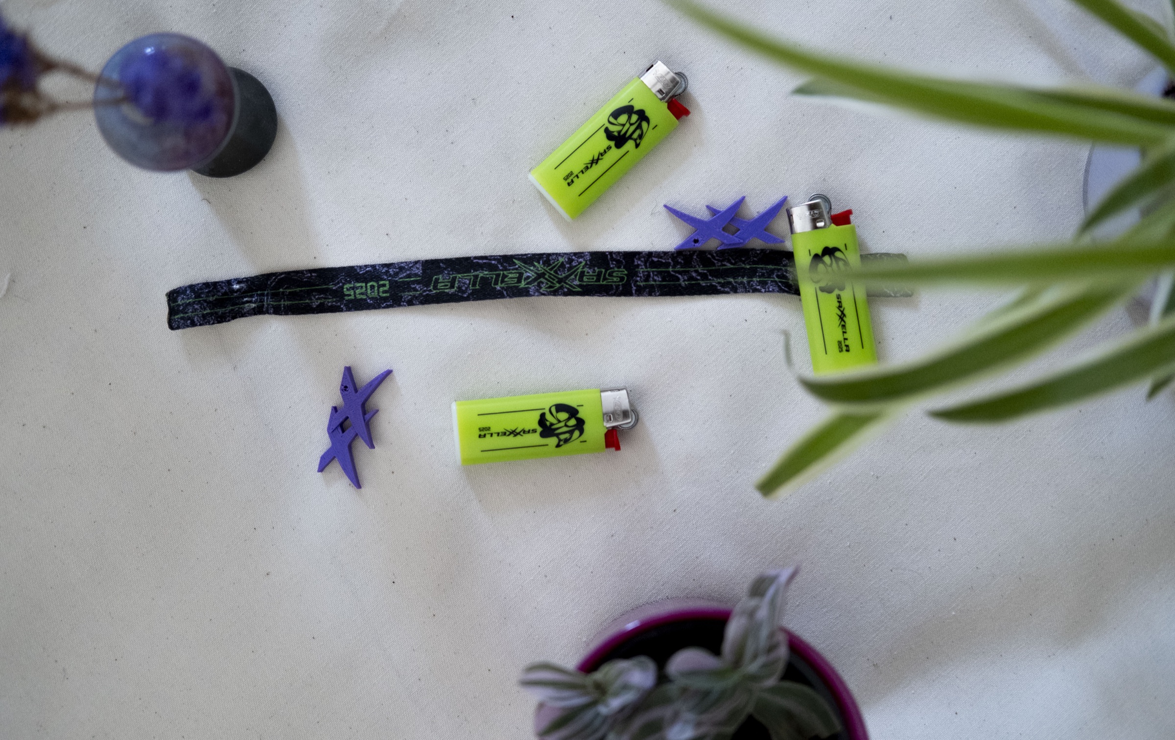 Lighters and a wristband from the welcome bag in the festival design